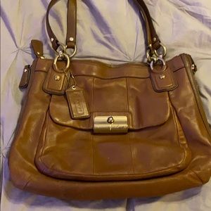 Well worn coach handbag.